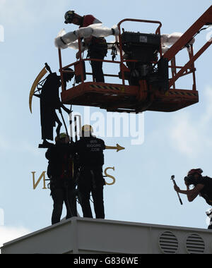 The Old Father Time weather vane is reinstated on the clock tower following repairs to damage at Lord's cricket ground, London. Stock Photo