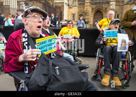 Disability rights campaigners protest outside the Houses of Parliament, in Westminster, London, after they had disrupted a session of Prime Minister's Questions. Stock Photo