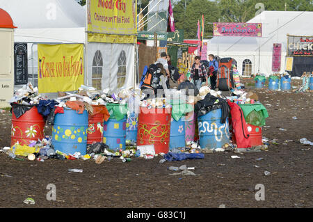 Overflowing bins at the Glastonbury Festival, at Worthy Farm, Somerset. Stock Photo