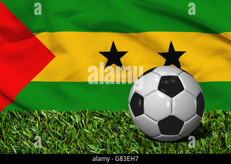 3D rendered soccer ball in grass field with Sao Tome and Principe flag as Background Stock Photo