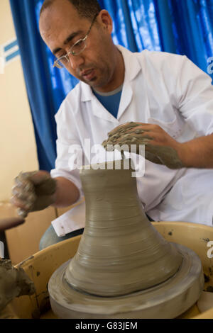 A student works in the pottery workshop at the Institute of Traditional Arts in Fez, Morocco. Stock Photo