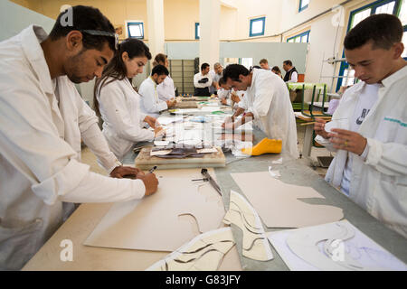 Students learn shoe making, design and leatherwork at the Institute of Traditional Arts in Fez, Morocco. Stock Photo