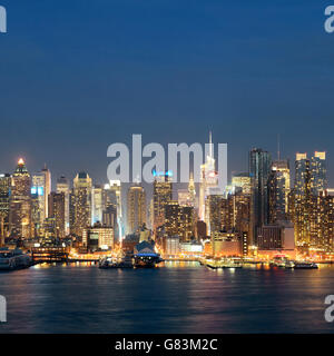 Midtown skyline over Hudson River in New York City with skyscrapers at ...