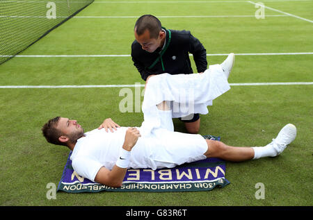 Dan Evans receives treatment during his match against Jan-Lennard ...