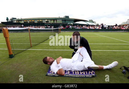 Dan Evans receives treatment during his match against Jan-Lennard ...