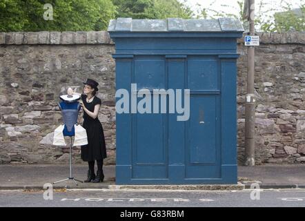 STANDALONE Photo. Costume designer Felicity Jean Edmond with one of her designs at a Police Box on Whitehouse Loan in Edinburgh, during the 2015 Edinburgh Police Box Festival. Stock Photo