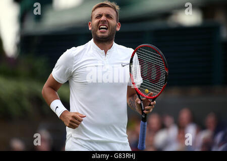 Daniel Evans reacts during the fourth set on day One of the Wimbledon ...