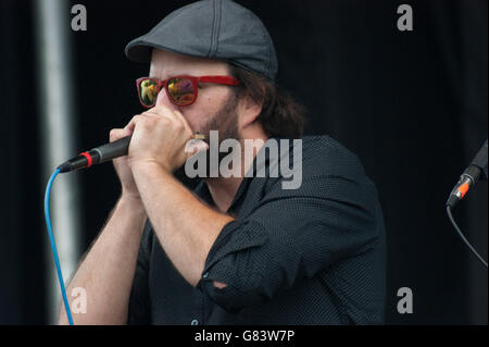 Pierre-Luc Dupuis playing harmonica, Quebecois musician for De Temps Antan performing at the 2015 American Folk Festival Stock Photo
