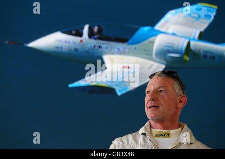 Pilot Didier Esteyne talks to the media during a news conference after landing the E-Fan electrically powered aeroplane at Calais Airport in France, following his successful crossing of The Channel from Lydd Airport in Kent. Stock Photo