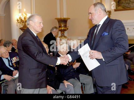Commander Eddie Grenfell, (left) a survivor of the Artic Convoys of 1941-45 at the Russian Embassy in London where he received a commemorative medal from the Russian Ambassador, Gregory Karasin, marking the 60th anniversary of the end of what Russians term the 'Great Patriotic War'. Stock Photo