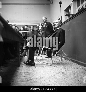 Prime Minister Sir Alec Douglas-Home rocks back in his chair at a meeting in the Perth cattle market, when he opened his campaign in the Kinross and West Perthshire by-election. Stock Photo