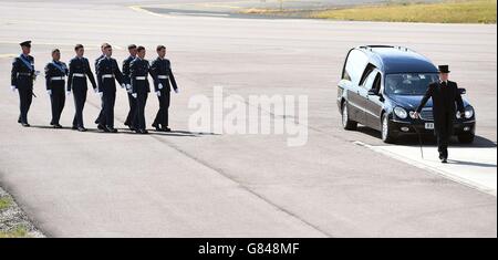 Pallbearers arrive at RAF Brize Norton in Oxfordshire, as the final five bodies returned today, out of a total of thirty British nationals killed in last week's Tunisia terrorist attack. Stock Photo