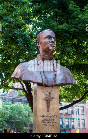 Archbishop John J. Hughes statue in front of the old St. Patrick's Basilica in Little Italy, New York City Stock Photo