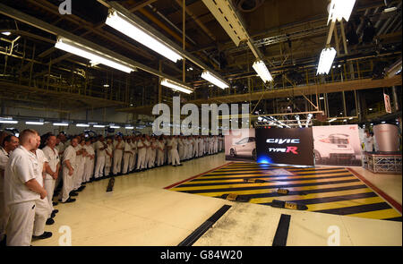 Workers at Honda of the UK Manufacturing Ltd's factory in Swindon await the arrival off the production line of the new Civic Type R Stock Photo