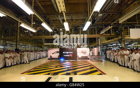 Workers at Honda of the UK Manufacturing Ltd's factory in Swindon await the arrival off the production line of the new Civic Type R Stock Photo