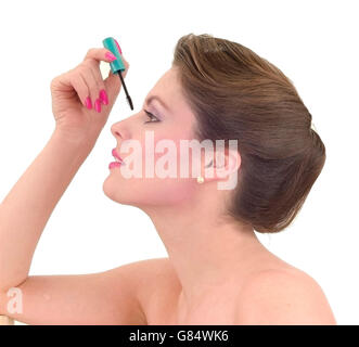 girl applying mascara Stock Photo