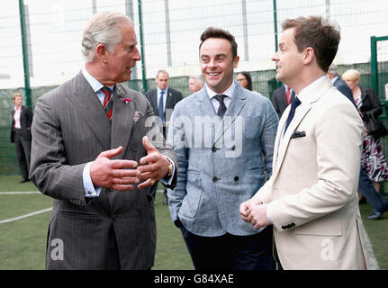 The Prince of Wales meets Anthony McPartlin and Declan Donnelly, supporters of the Prince's Trust, ahead of meeting young offenders taking part in a 'Get Started with Football' programme run by the Prince's Trust during a visit to Parc Prison in Bridgend, Wales. Stock Photo