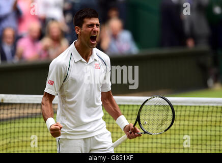 Novak Djokovic celebrates beating Roger Federer in the Mens Singles Final on day Thirteen of the Wimbledon Championships at the All England Lawn Tennis and Croquet Club, Wimbledon. Stock Photo