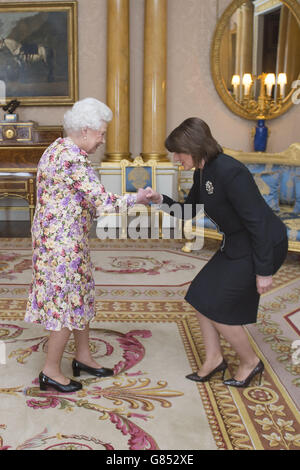 Queen Elizabeth II receives the President of the Republic of Kosovo Atifete Jahjaga during an audience at Buckingham Palace, London. Stock Photo