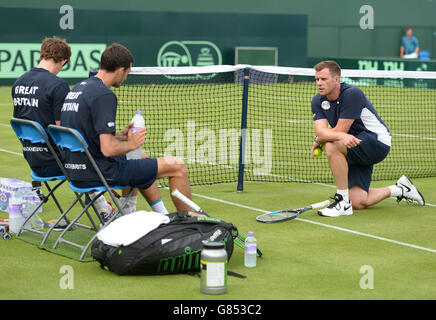 Great Britain captain Leon Smith (right) chats with Andy Murray (left) and James Ward ahead of Great Britain's Davis Cup match against France at The Queen's Club, London. Stock Photo