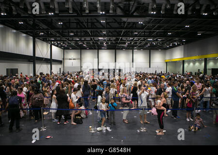 Young girls queue at the Excel in London for the opportunity to star in the Harry Potter spinoff film Fantastic Beasts And Where To Find Them, the open auditions have attracted scores of budding actresses between 8-12 hoping to be the chosen for the role Modesty, a 'haunted young girl with an inner strength and stillness'. Stock Photo