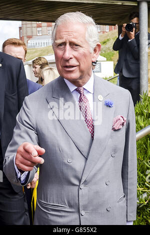 The Prince of Wales points during his visit to Fistral Beach, Newquay, as part of a Royal tour of Cornwall. Stock Photo