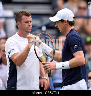 Great Britain's Andy Murray (right) and Captain Leon Smith (left) during day one of the Davis Cup Quarter Finals between Great Britain and France at the Queen's Club, London. Stock Photo