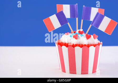 Happy Bastille Day cupcake with red, white and blue french flags. Stock Photo