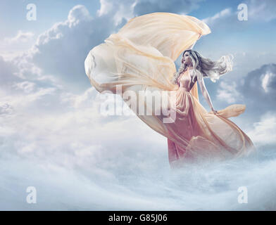 Fairy image of a beautiful young woman in the clouds Stock Photo