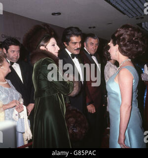 Princess Margaret talks with American actress Barbra Streisand (l) and Egyptian actor Omar Sharif (c) at the Royal Premiere of the film they are both appearing in 'Funny Girl' being held at the Odeon Theatre, Leicester Square, London. Stock Photo