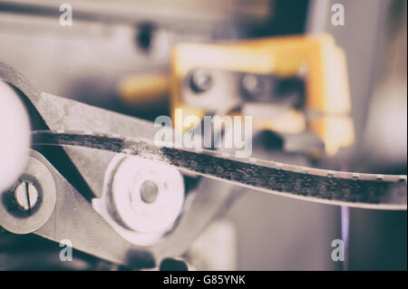 Detail of super 8 mm film in projector spool macro close up selective focus Stock Photo
