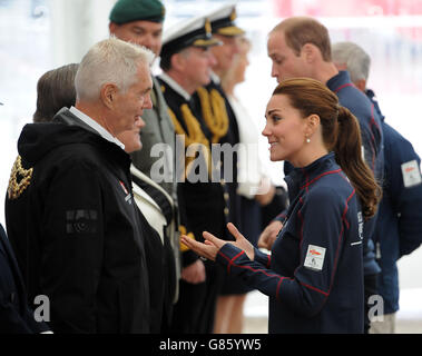 The Duchess of Cambridge (right) talks to Dr Harvey Schiller, Commercial Commissioner of the 35th America's Cup as she arrives with the Duke of Cambridge (right) at the team technical areas at the Royal Navy Historic Dockyard, Portsmouth, during a visit on the second day of the opening leg of the America's Cup World Series being staged in waters off Portsmouth. Stock Photo