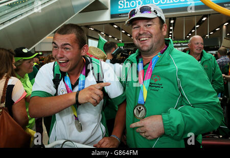 Special Olympics Team Ireland athletes Leo O'Brien (left) and Oliver Doherty arrive back at Dublin Airport, having represented Ireland in the 2015 Special Olympics in Los Angeles. Stock Photo