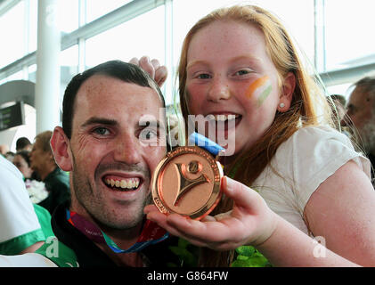 Special Olympics Team Ireland athlete Leon Kehoe, with his sister Caoimhe 8, arrives back at Dublin Airport, having represented Ireland in the 2015 Special Olympics in Los Angeles. Stock Photo