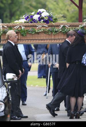 The coffin of George Cole is carried into Reading Crematorium for his funeral. Stock Photo