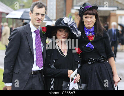 George Cole's family (left-right) son, wife Penny Morrell and daughter Tara at Reading Crematorium following his funeral. Stock Photo