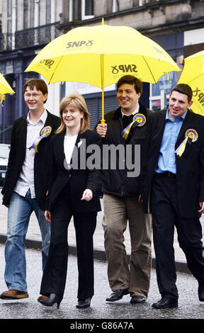 Scottish National Party deputy leader Nicola Sturgeon meets young supporters, (from left to right) Davie Hutchieson, Jamie Hepburn and Graeme Hendry. Stock Photo