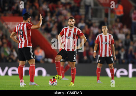 Southampton's Graziano Pelle and Jay Rodriguez (centre) stand dejected after FC Midtjylland's Tim Sparv (not in picture) scores his side's first goal of the game during the UEFA Europa League, Qualifying Play-offs, First Leg at St Mary's Stadium, Southampton. Stock Photo