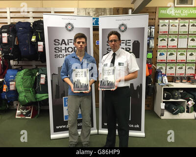 Angus Miller (left), manager of the Cotswold store in Belfast city centre, with Temporary Assistant Chief Constable Chris Noble at the launch of the Police Service of Northern Ireland Safe Shop Scheme. Stock Photo