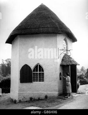 An old toll house on the Bristol-Chew Magna road at Stanton Drew, Somerset. A family now lives in the unusual home, which features a post box next to the front door. Stock Photo