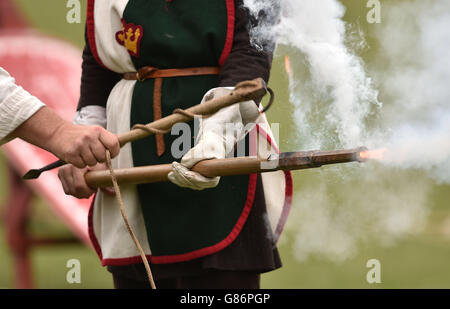 750th Anniversary of the Battle of Evesham. A rifle is fired as re-enactors play out the Battle of Evesham at Abbey Park in Evesham. Stock Photo