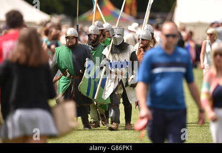 Re-enactors make their way through Abbey Park in Evesham as they prepare to play out the Battle of Evesham. Stock Photo