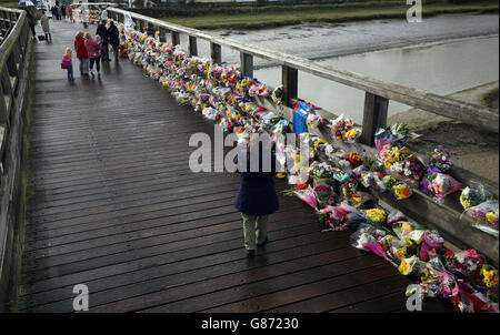 People stop to read floral tributes which have been placed on the Old Tollbridge near the A27 at Shoreham in West Sussex close to the scene of the Shoreham air disaster. Stock Photo