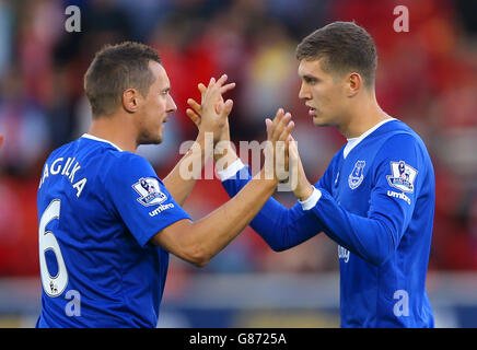 Soccer - Capital One Cup - Second Round - Barnsley v Everton - Oakwell. Everton's Phil Jagielka (left) and John Stones during the Capital One Cup, second round match at Oakwell, Barnsley. Stock Photo