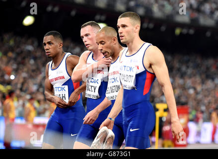Great Britain's Mens 4x100m relay team of Richard Kilty (second left), Daniel Talbot (right), James Ellington and Chijindu Ujah (left) after the race after they fail of finish during day eight of the IAAF World Championships at the Beijing National Stadium, China. Stock Photo