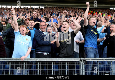 Manchester City fans celebrate in the stands during the Barclays Premier League match at The Hawthorns, West Bromwich. PRESS ASSOCIATION Photo. Picture date: Monday August 10, 2015. See PA story SOCCER West Brom. Photo credit should read: David Davies/PA Wire. . No use with unauthorised audio, video, data, fixture lists, club/league logos or 'live' services. Online in-match use limited to 45 images, no video emulation. No use in betting, games or single club/league/player publications. Stock Photo