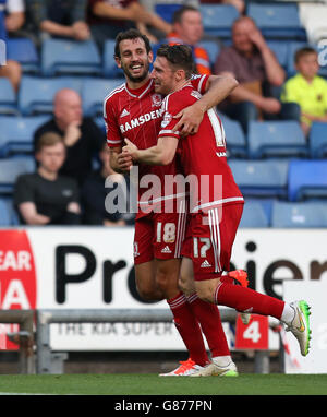 Middlesbrough's Christian Stuani (left) celebrates scoring his sides second goal with team-mate James Husband during the Capital One Cup, First Round match at SportsDirect.com Park, Oldham. Stock Photo