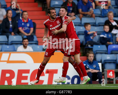 Middlesbrough's Christian Stuani (left) celebrates scoring his sides second goal with team-mate James Husband during the Capital One Cup, First Round match at SportsDirect.com Park, Oldham. Stock Photo