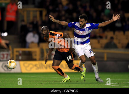 Wolverhampton Wanderers' Benik Afobe (left) and Queens Park Rangers' James Perch battle for the ball Stock Photo