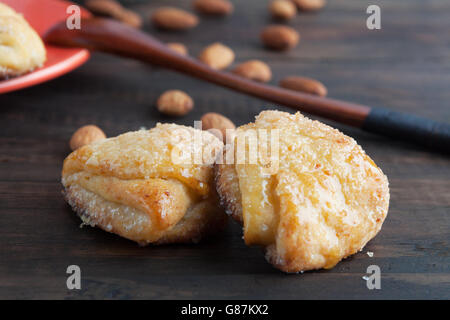 Sweet cottage cheese cookies closeup with almonds in the background. Shallow depth of field Stock Photo